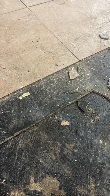 Black bitumen mastic floor removal in a SE13 flat